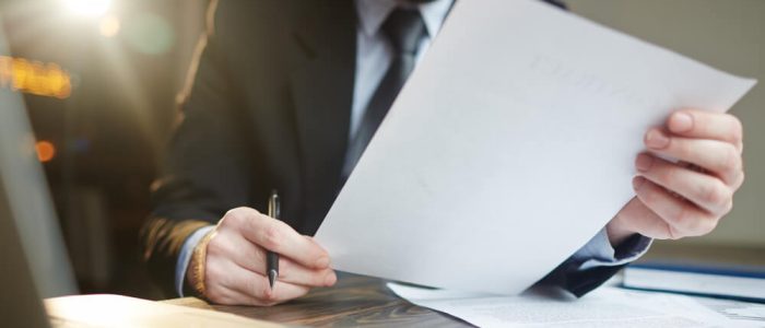 businessman-working-with-documentation-at-desk (1)